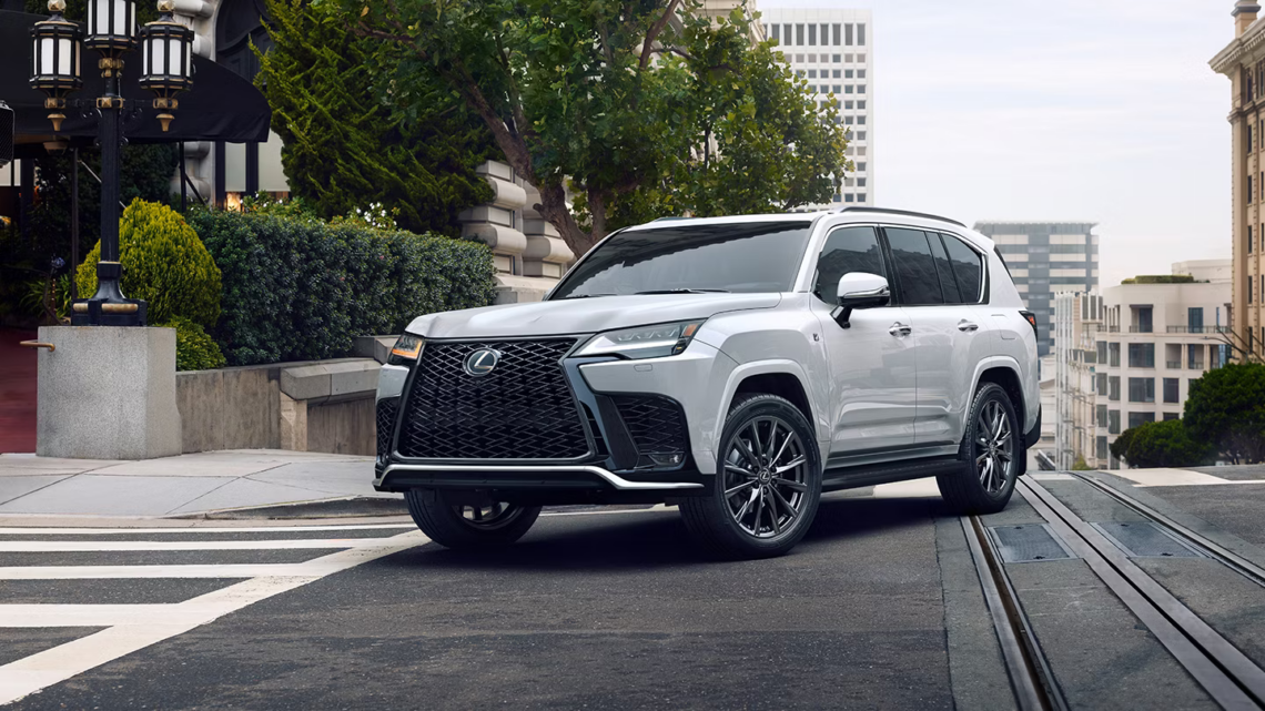 A Lexus F Performance SUV driving in the city