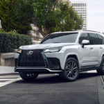 A Lexus F Performance SUV driving in the city