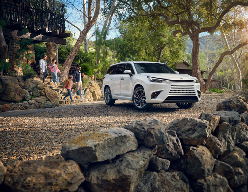 Family standing near the 2026 Lexus TX