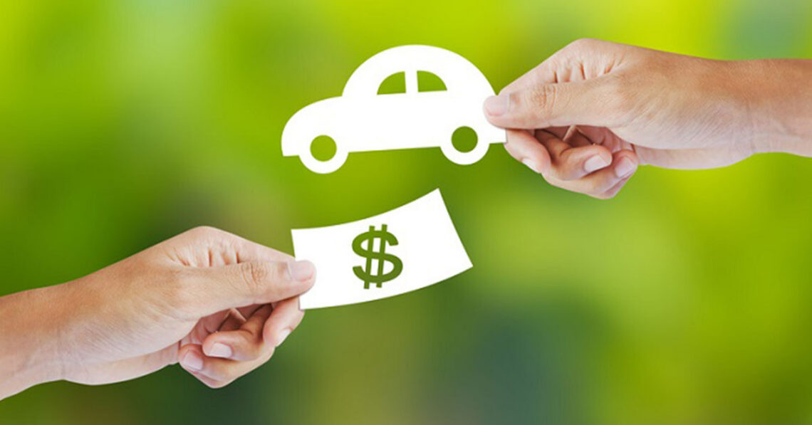 Hands exchanging 2D cash and car representing Lexus trade-in value